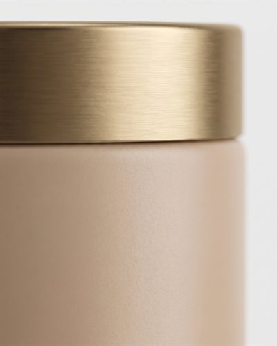 Macro de la tapa y la textura del tarro de crema